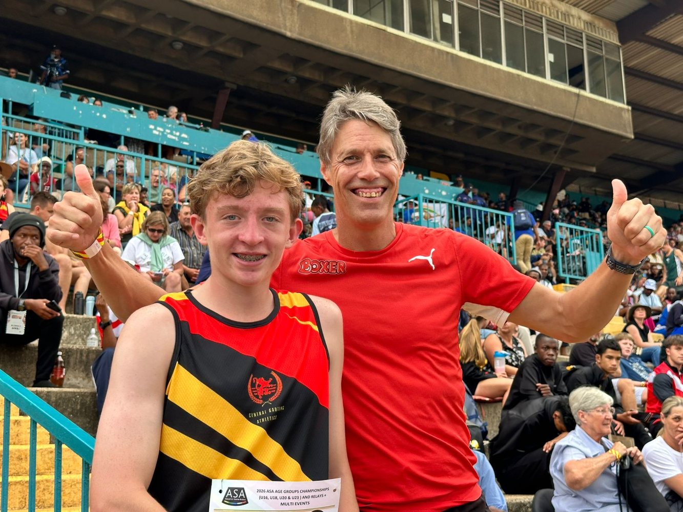 Coach Clint with a young athlete at the track